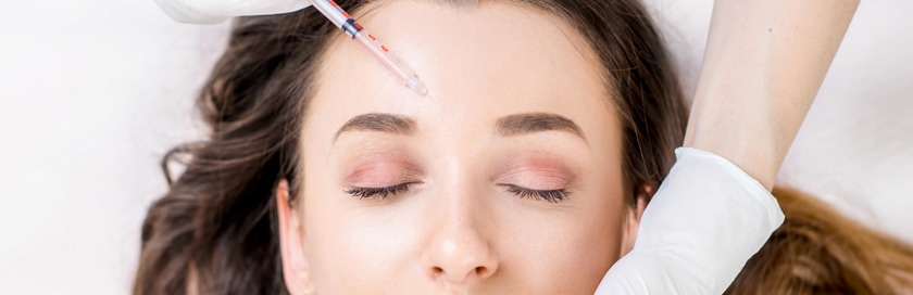 A woman getting a Botox® injection.