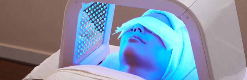 A woman getting Celluma® LED light therapy.